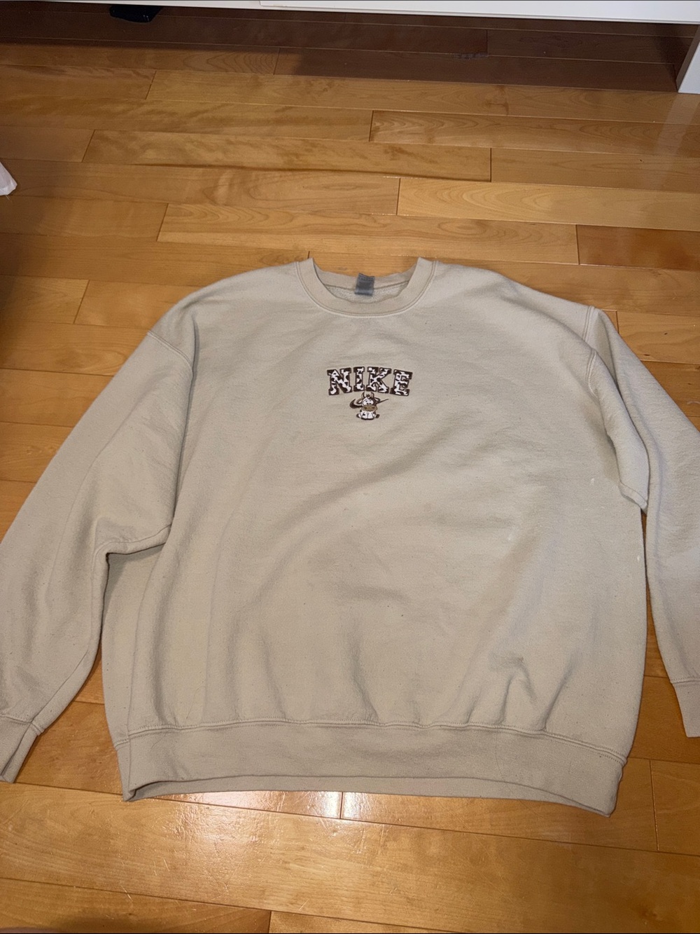 Cream/Tan Crewneck Sweatshirt with cow fake “Nike” Logo